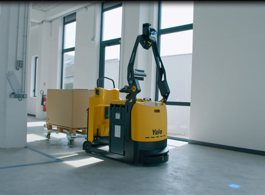 Yale shows off its material handling robots Yale Europe has showcased its latest affordable robotic solutions designed to complete repetitive material handling tasks.   At an invitation-only ‘This is Yale’ event near Dusseldorf in Germany, the company presented a number of automated machines in front of selected dealers and customers.   “Having the opportunity to present our robotics solutions has been an exciting moment for everyone involved,” said Ron Farr, warehouse solutions manager for Yale.   “As the Industry 4.0 trend continues, our robotics range can open the door to more flexible, affordable solutions that don’t require the installation of a physical infrastructure to support navigation which can be time consuming, costly to install, and disruptive to the operation.”   The new Yale robotic tow tractor took part in a demonstration highlighting its ability to support lineside production and logistics ‘milk run’ loops. Capable of towing several trailers at a time, the robotic tow tractor can deliver new kits to line operators while collecting empty containers simultaneously, ensuring production lines are fed ‘just-in-time’ and ‘just-in-sequence’ for boosting productivity.   Tracy Brooks, industry solutions group manager at Yale, said, “After the initial mapping, the Yale MO50-70T robotic tow tractors can operate autonomously, there’s no need to bury wires in the floor or mount reflectors on the wall. Once it’s received its instruction, the robotic tow tractor can self-locate and navigate to its first destination. It can carry components needed to feed the production line and deliver them to the correct line-side point.”   Mapping and navigating combo The Balyo geoguidance navigation system – where the MC15 robotic counterbalance stacker uses the same sensors to map the facility that it uses to navigate it – was demonstrated, and visitors to the event discovered how the technology enables the robotic truck to be up and running without the need for dedicated navigation infrastructure.   The robotic counterbalance stacker is capable of both horizontal transport and vertical lifting, making it ideally suited to warehouse applications. The truck’s ability to lift and lower loads means it can autonomously deposit and retrieve pallets from racking with ease.   Suitable for a wide variety of repetitive jobs including transferring pallets to conveyor lines, loading and unloading in cross-docking applications, and stacking loads in elevated spaces, the truck can help free up the existing workforce for higher-value tasks.   With no dedicated infrastructure required, visitors learned how the robotic counterbalance stackers operate autonomously without the need for any wires, magnets or reflectors. This reduces the cost of installation and virtually eliminates ongoing structural maintenance. 