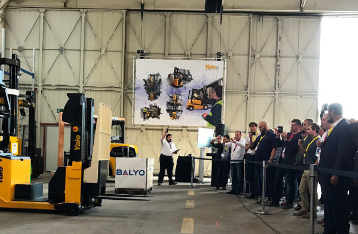 Yale shows off its material handling robots Yale Europe has showcased its latest affordable robotic solutions designed to complete repetitive material handling tasks. At an invitation-only ‘This is Yale’ event near Dusseldorf in Germany, the company presented a number of automated machines in front of selected dealers and customers. “Having the opportunity to present our robotics solutions has been an exciting moment for everyone involved,” said Ron Farr, warehouse solutions manager for Yale. “As the Industry 4.0 trend continues, our robotics range can open the door to more flexible, affordable solutions that don’t require the installation of a physical infrastructure to support navigation which can be time consuming, costly to install, and disruptive to the operation.” The new Yale robotic tow tractor took part in a demonstration highlighting its ability to support lineside production and logistics ‘milk run’ loops. Capable of towing several trailers at a time, the robotic tow tractor can deliver new kits to line operators while collecting empty containers simultaneously, ensuring production lines are fed ‘just-in-time’ and ‘just-in-sequence’ for boosting productivity. Tracy Brooks, industry solutions group manager at Yale, said, “After the initial mapping, the Yale MO50-70T robotic tow tractors can operate autonomously, there’s no need to bury wires in the floor or mount reflectors on the wall. Once it’s received its instruction, the robotic tow tractor can self-locate and navigate to its first destination. It can carry components needed to feed the production line and deliver them to the correct line-side point.” Mapping and navigating combo The Balyo geoguidance navigation system – where the MC15 robotic counterbalance stacker uses the same sensors to map the facility that it uses to navigate it – was demonstrated, and visitors to the event discovered how the technology enables the robotic truck to be up and running without the need for dedicated navigation infrastructure. The robotic counterbalance stacker is capable of both horizontal transport and vertical lifting, making it ideally suited to warehouse applications. The truck’s ability to lift and lower loads means it can autonomously deposit and retrieve pallets from racking with ease. Suitable for a wide variety of repetitive jobs including transferring pallets to conveyor lines, loading and unloading in cross-docking applications, and stacking loads in elevated spaces, the truck can help free up the existing workforce for higher-value tasks. With no dedicated infrastructure required, visitors learned how the robotic counterbalance stackers operate autonomously without the need for any wires, magnets or reflectors. This reduces the cost of installation and virtually eliminates ongoing structural maintenance.